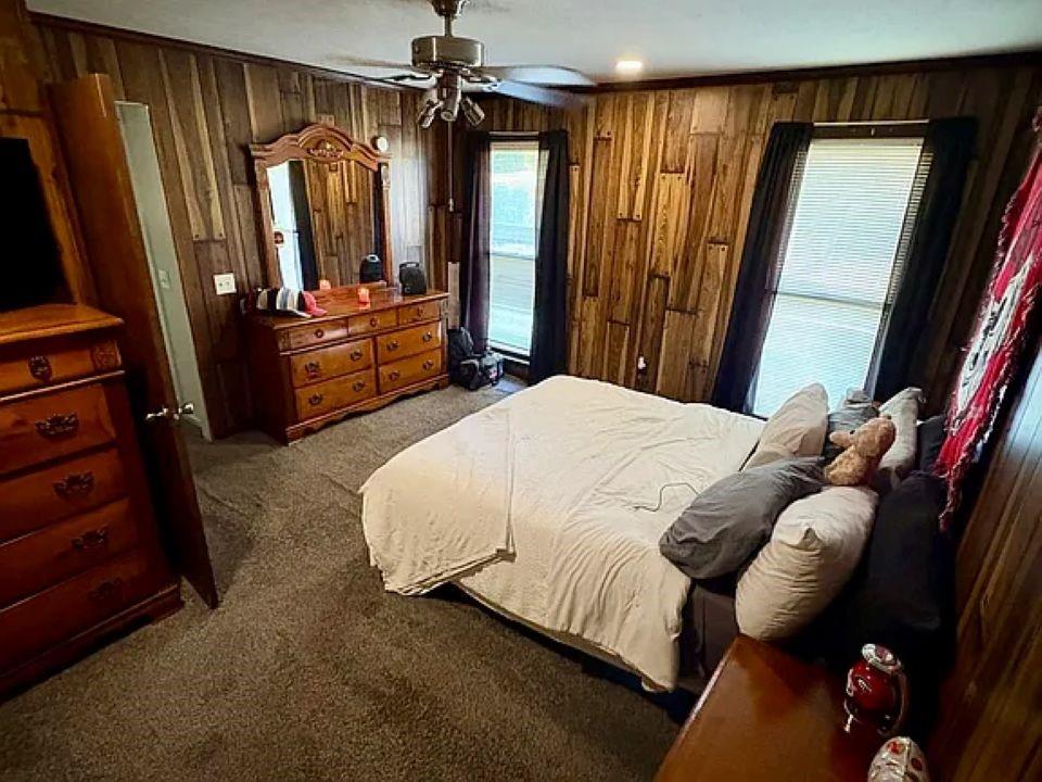 781 Thomas Street Roopville, GA 30170 - Photo 8 of 14 a bedroom with a bed and a mirror