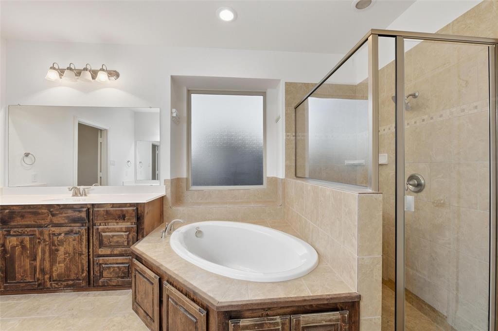 1321 Talley Lane Frisco, TX 75033 - Photo 18 of 40 Bathroom featuring a stall shower, a bath, vanity, recessed lighting, and light tile patterned floors
