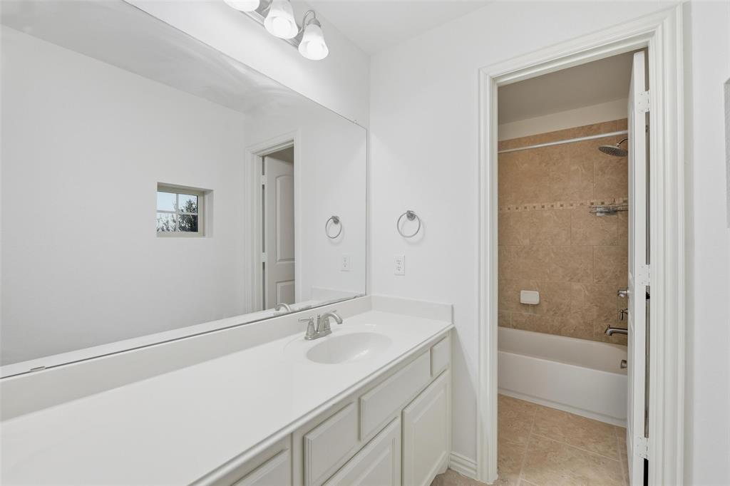 1321 Talley Lane Frisco, TX 75033 - Photo 23 of 40 Full bathroom with vanity, shower / bathtub combination, and light tile patterned flooring