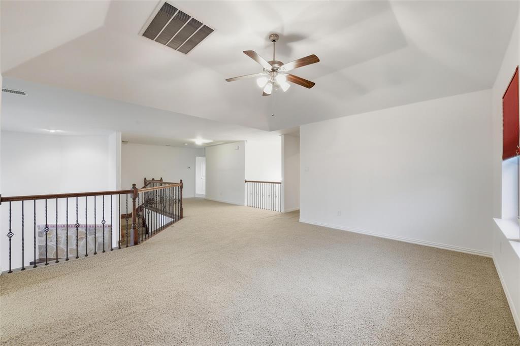 1321 Talley Lane Frisco, TX 75033 - Photo 33 of 40 Spare room with light colored carpet and a ceiling fan