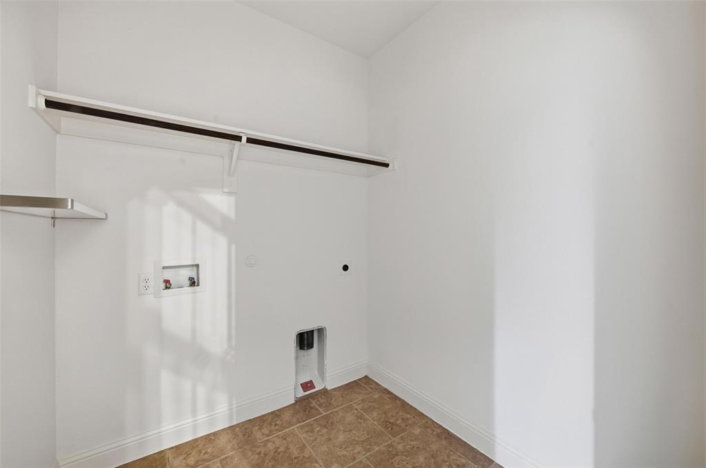 1321 Talley Lane Frisco, TX 75033 - Photo 34 of 40 Washroom with hookup for a washing machine, tile patterned floors, electric dryer hookup, and hookup for a gas dryer