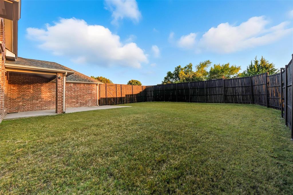 1321 Talley Lane Frisco, TX 75033 - Photo 36 of 40 Fenced backyard with a patio area