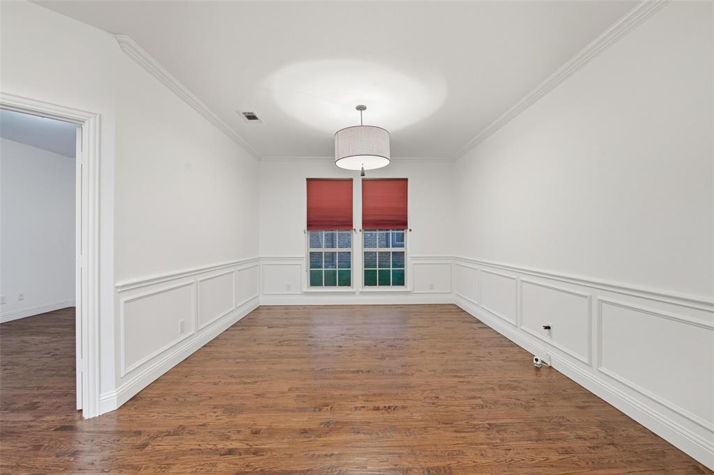 1321 Talley Lane Frisco, TX 75033 - Photo 6 of 40 Unfurnished dining area featuring ornamental molding and dark wood-style floors