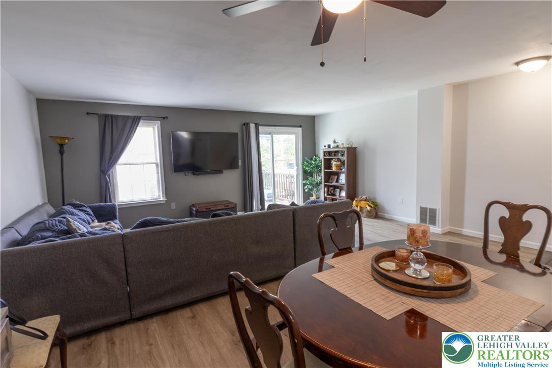 257 Ridgeview Drive Alburtis, PA 18011 - Photo 4 of 24 Blends functionality and comfort, this living area with durable flooring features an overhead fan and abundant natural light.