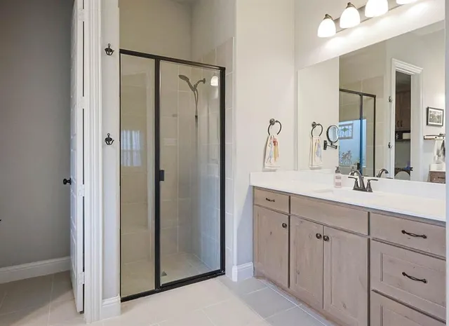 a bathroom with a double vanity sink mirror and double