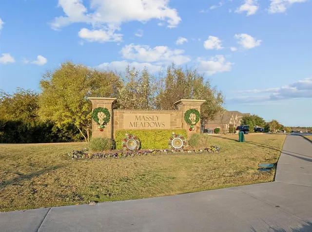a view of a park with houses