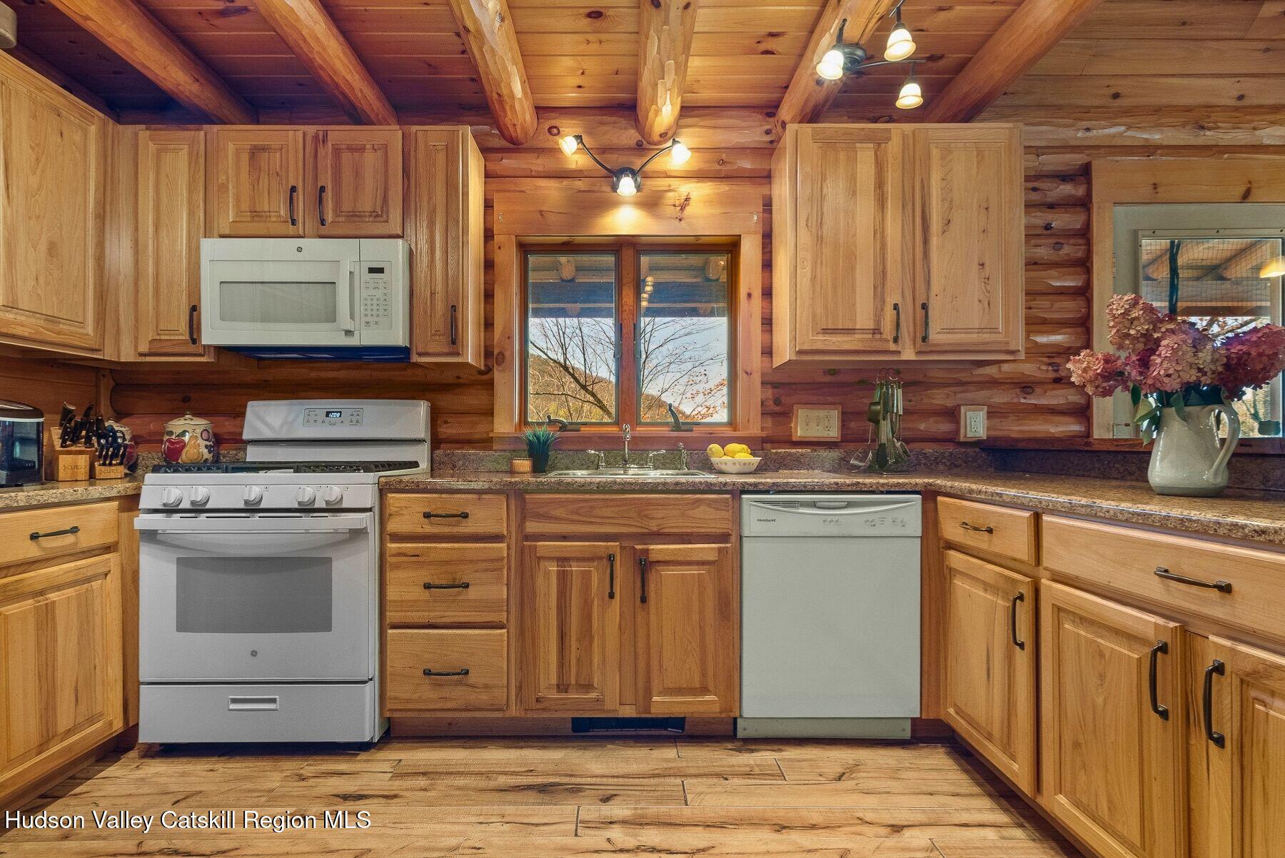 281 Turk Hollow Road Fleischmanns, NY 12430 - Photo 12 of 30 a kitchen with stainless steel appliances granite countertop a sink stove and cabinets