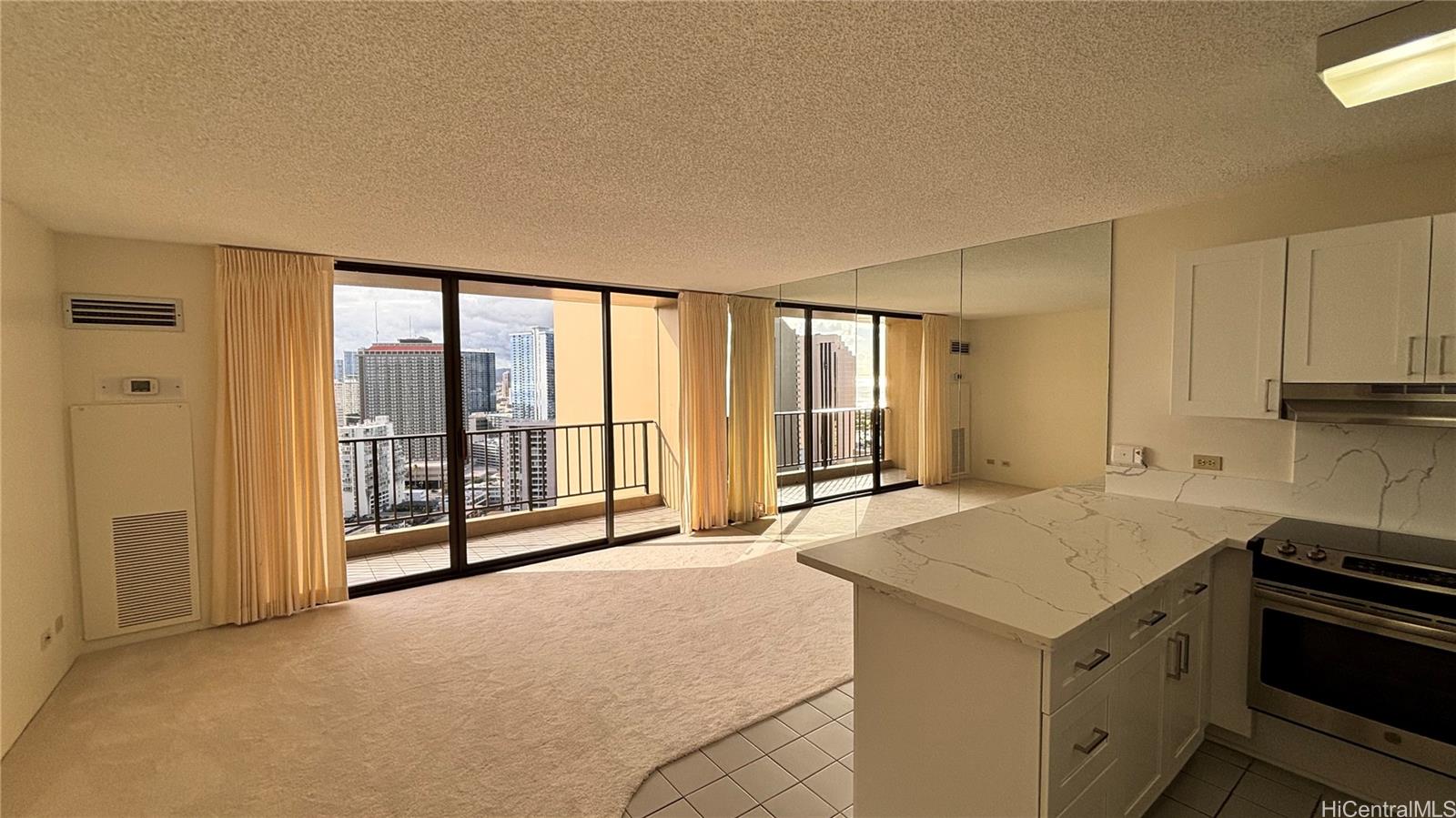 411 Hobron Lane, Unit 3208 Honolulu, HI 96815 - Photo 4 of 9 a view of a kitchen with a sink and cabinets