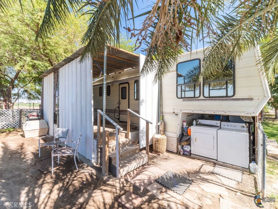 4898 Forrester Road Brawley, CA 92227 - Photo 5 of 10 a view of a house with a yard and sitting area