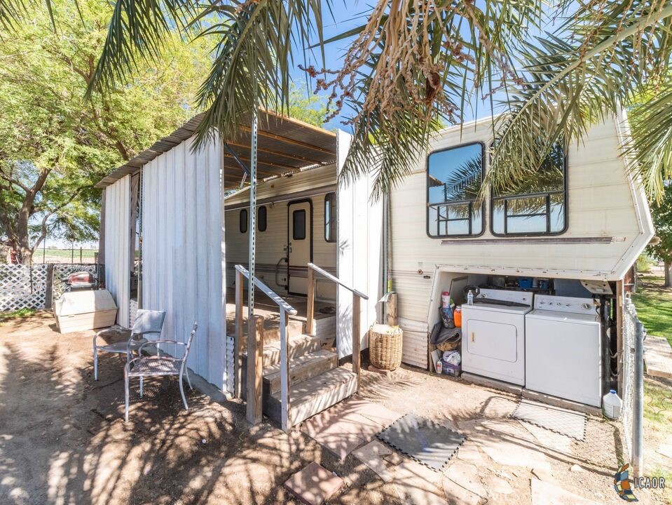 4898 Forrester Road Brawley, CA 92227 - Photo 8 of 10 a view of a house with a yard and sitting area