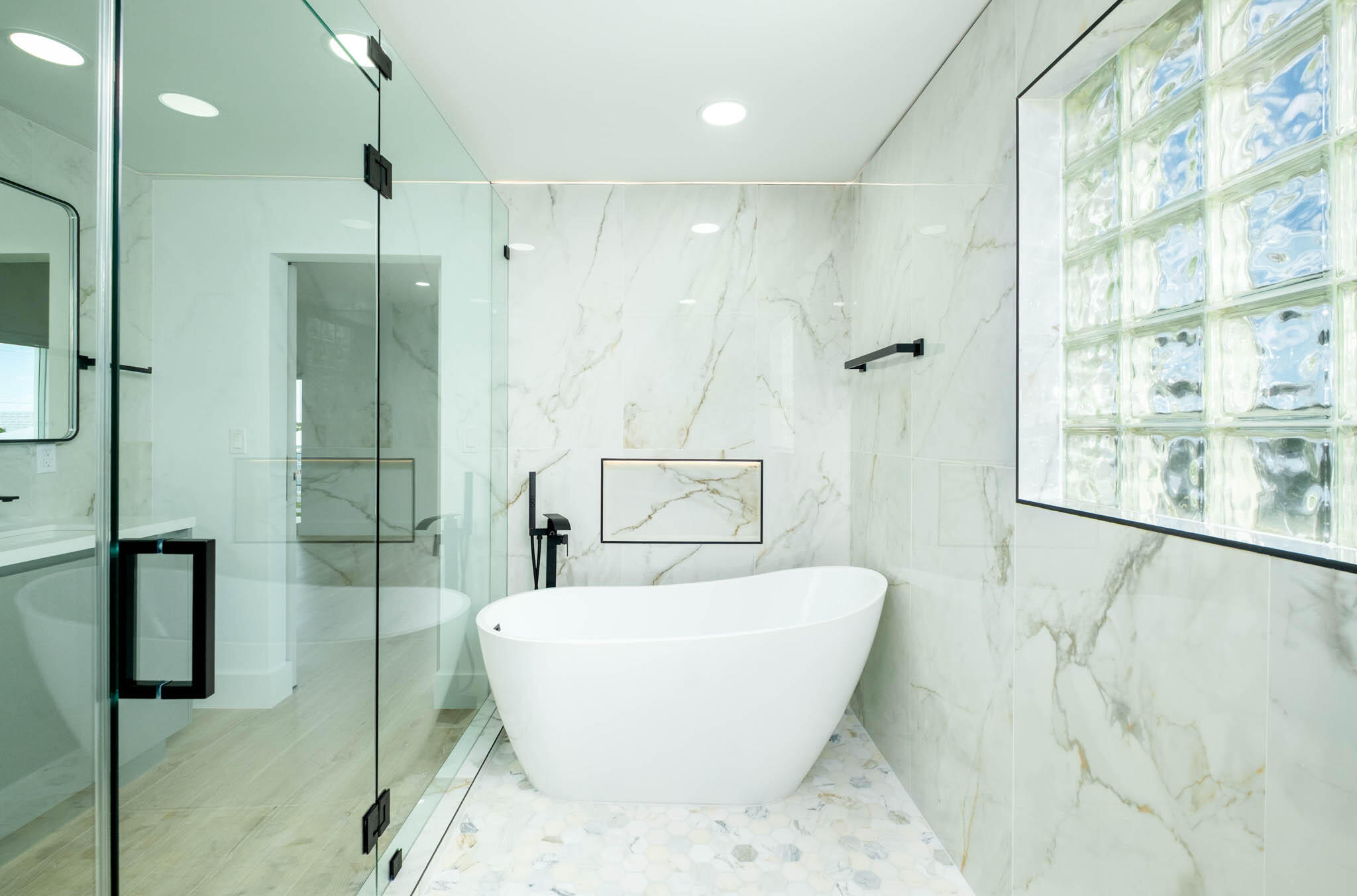 613 Portia Circle Key Largo, FL 33037 - Photo 18 of 40 a white bath tub sitting next to a shower