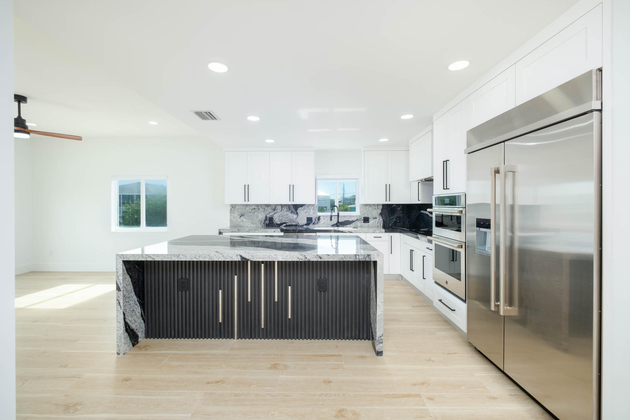 613 Portia Circle Key Largo, FL 33037 - Photo 2 of 40 a kitchen with stainless steel appliances a refrigerator and a sink
