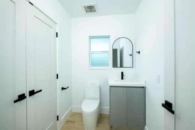 a bathroom with a sink and mirror