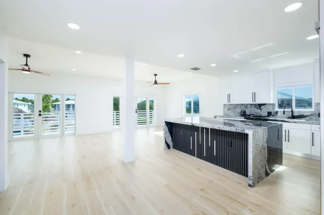 a kitchen with a sink and wooden cabinets