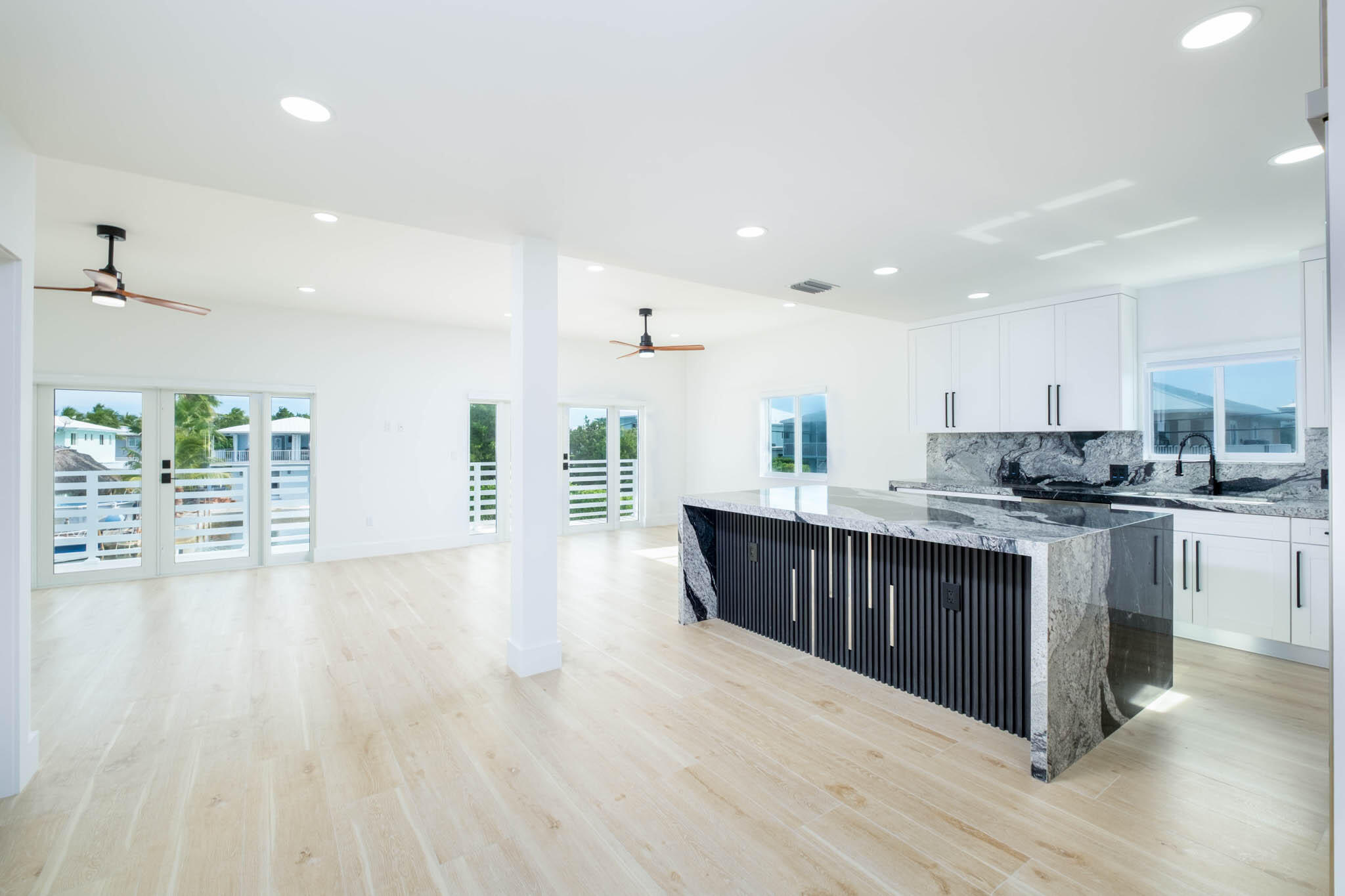 613 Portia Circle Key Largo, FL 33037 - Photo 3 of 40 a kitchen with a sink and wooden cabinets