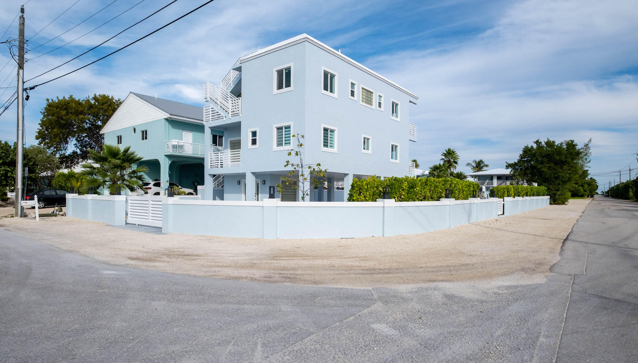 613 Portia Circle Key Largo, FL 33037 - Photo 36 of 40 a view of house with outdoor space and tall windows