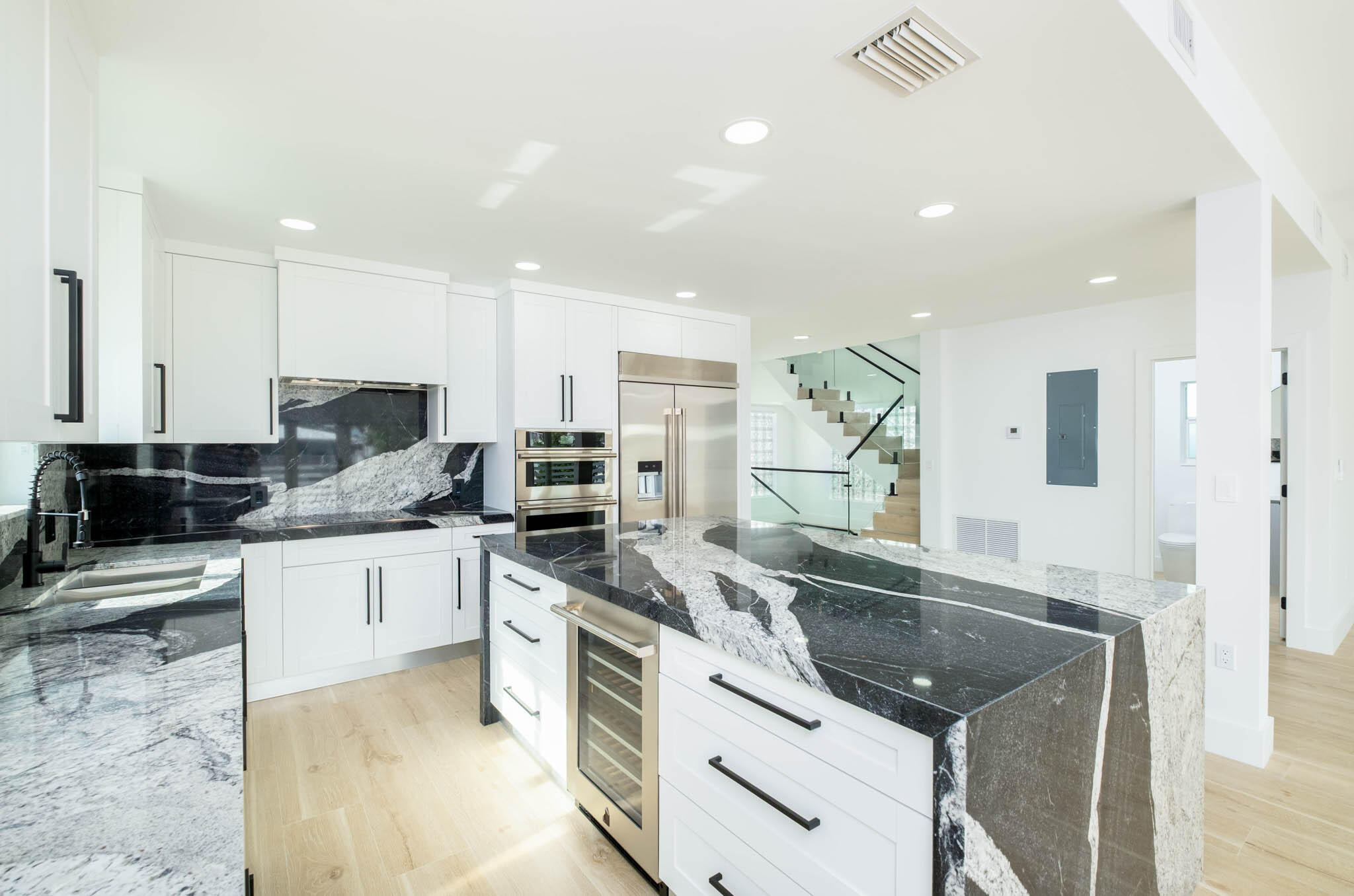 613 Portia Circle Key Largo, FL 33037 - Photo 4 of 40 a kitchen with stainless steel appliances granite countertop a sink stove and refrigerator