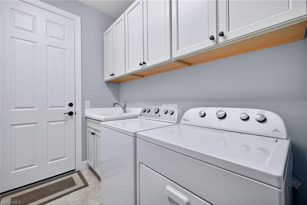 20105 Torch Key Way Estero, FL 33928 - Photo 20 of 29 a utility room with dryer and washer