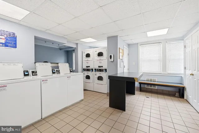 a kitchen with a cabinets and white appliances