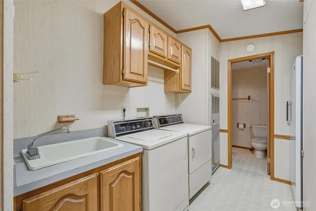 a utility room with dryer and washer