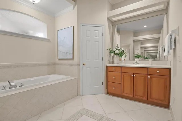 an empty room with a chandelier fan