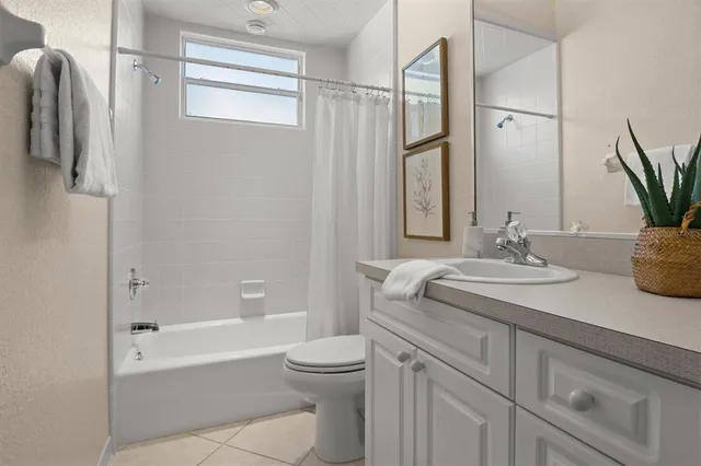 a kitchen with a sink cabinets and window