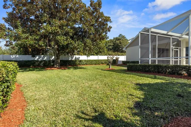 a view of a house with swimming pool and sitting area