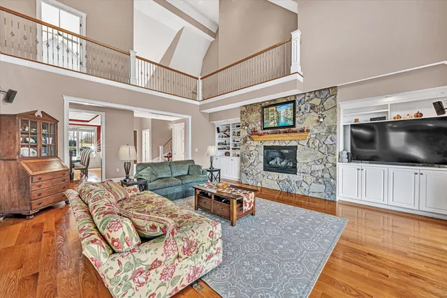 a bathroom with a granite countertop sink mirror vanity and toilet