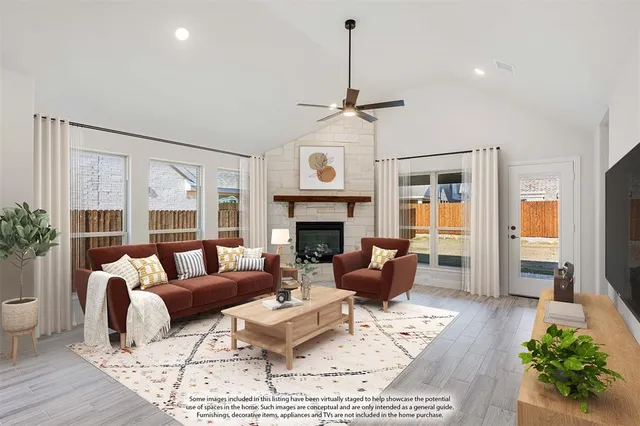 a living room with furniture wooden floor and a fireplace