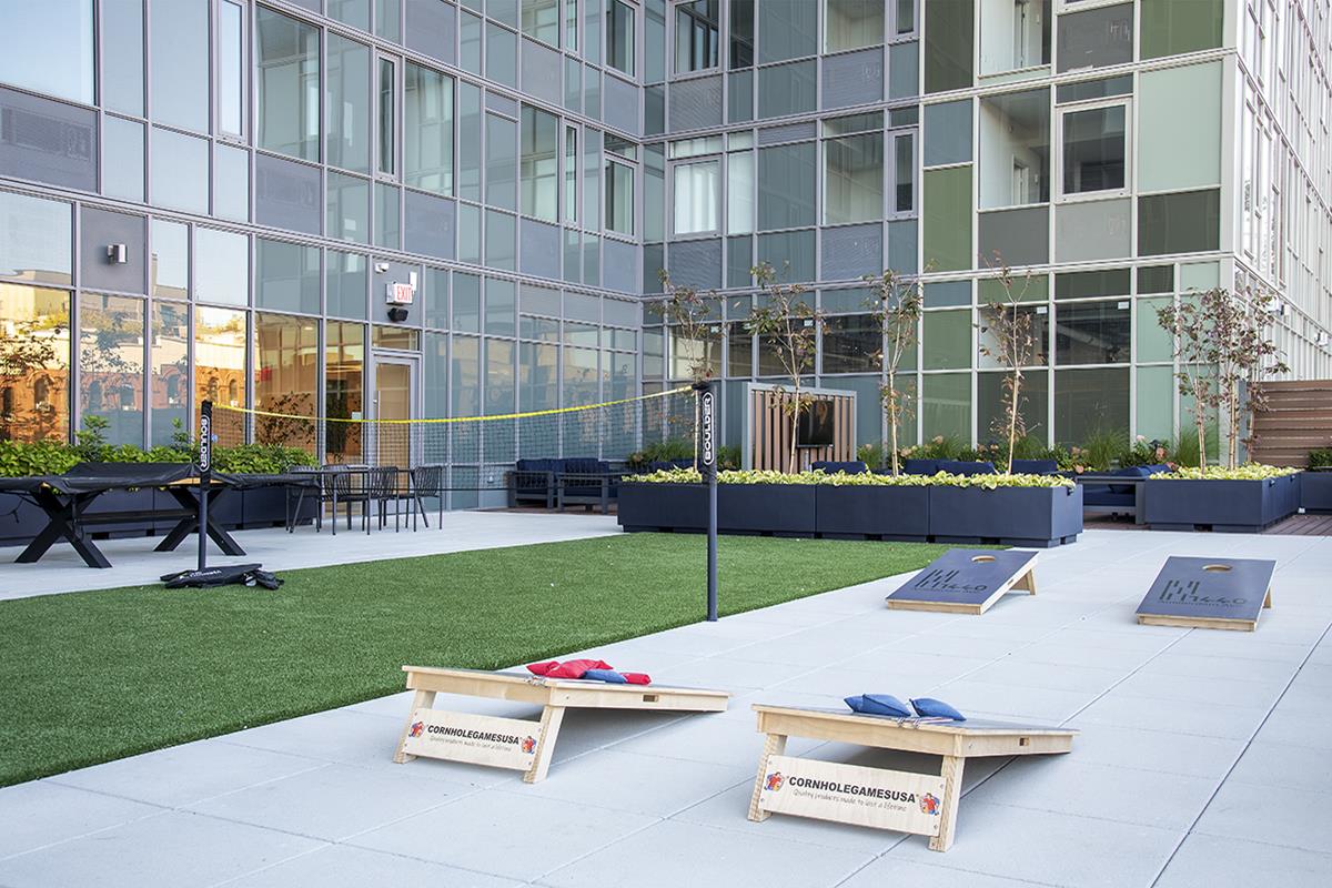 1440 Amsterdam Avenue, Unit 1707 Manhattan, NY 10027 - Photo 14 of 22 a view of an chairs and tables in the back yard of the house