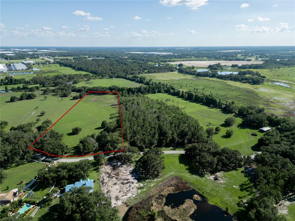 902 Giant Oak Road Lakeland, FL 33810 - Photo 1 of 1 a view of a green field with an ocean