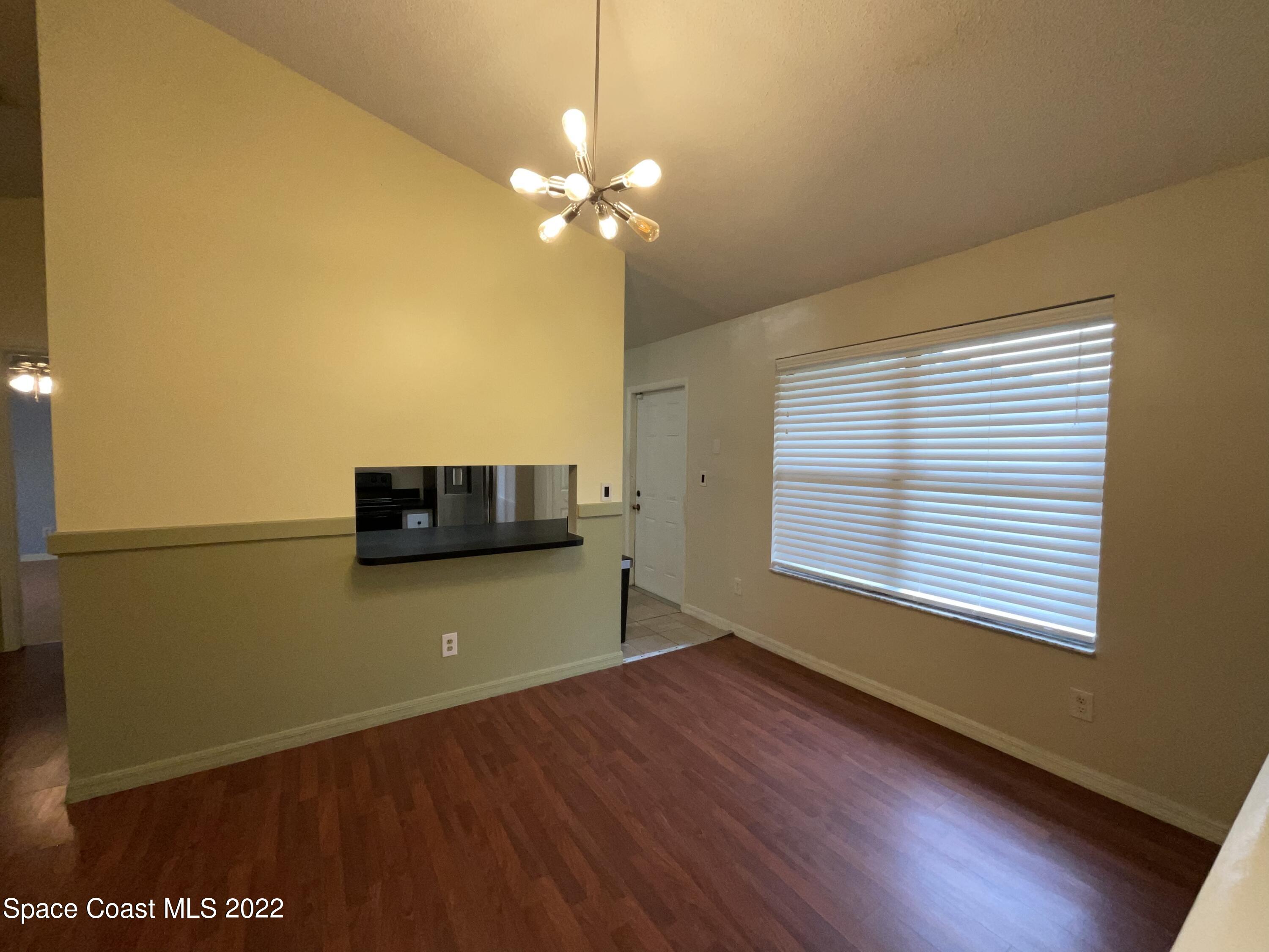 4844 Bridge Road Cocoa, FL 32927 - Photo 16 of 22 a view of a livingroom with an empty space and a window