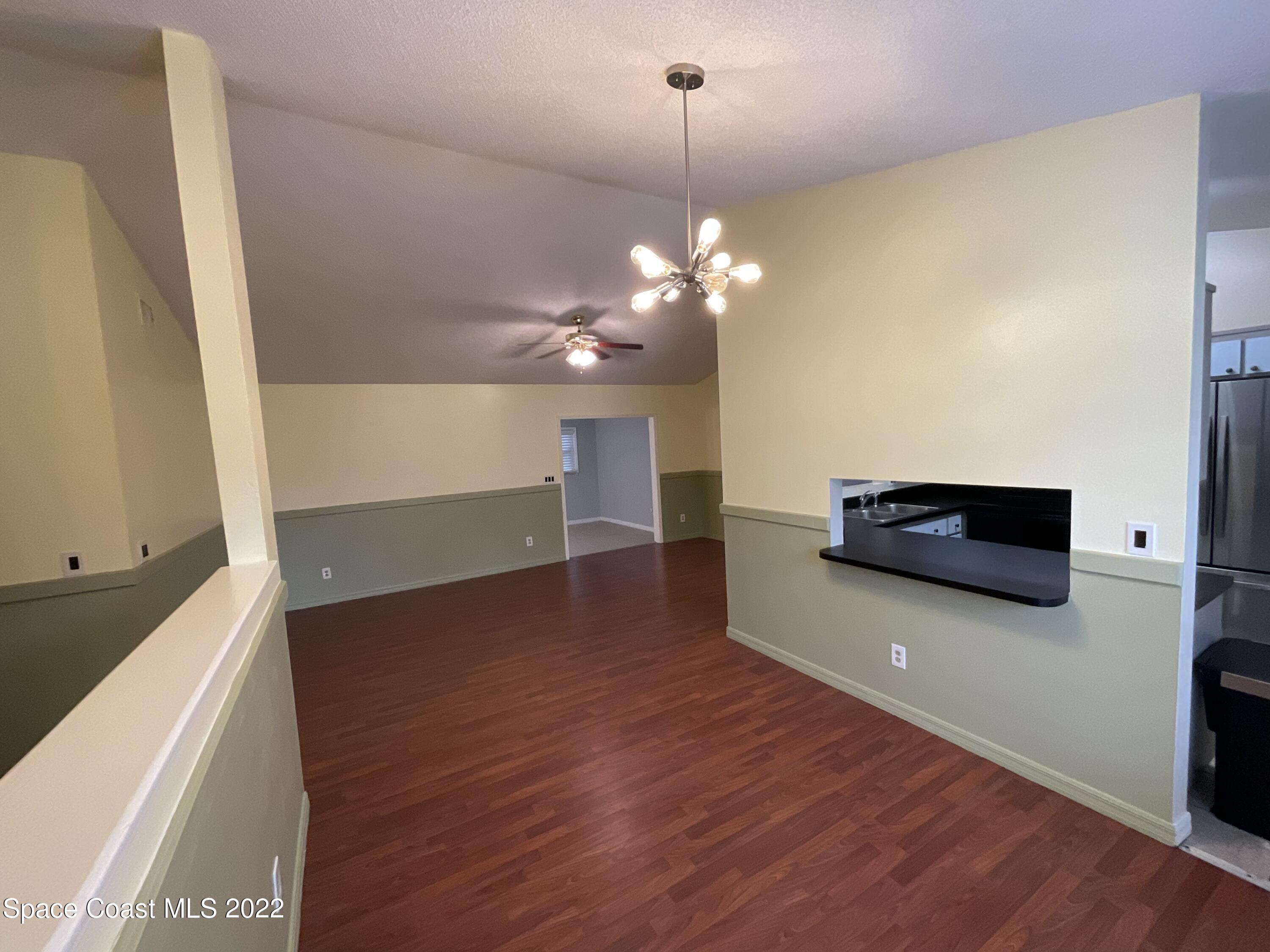4844 Bridge Road Cocoa, FL 32927 - Photo 17 of 22 a view of a livingroom with a furniture wooden floor and window
