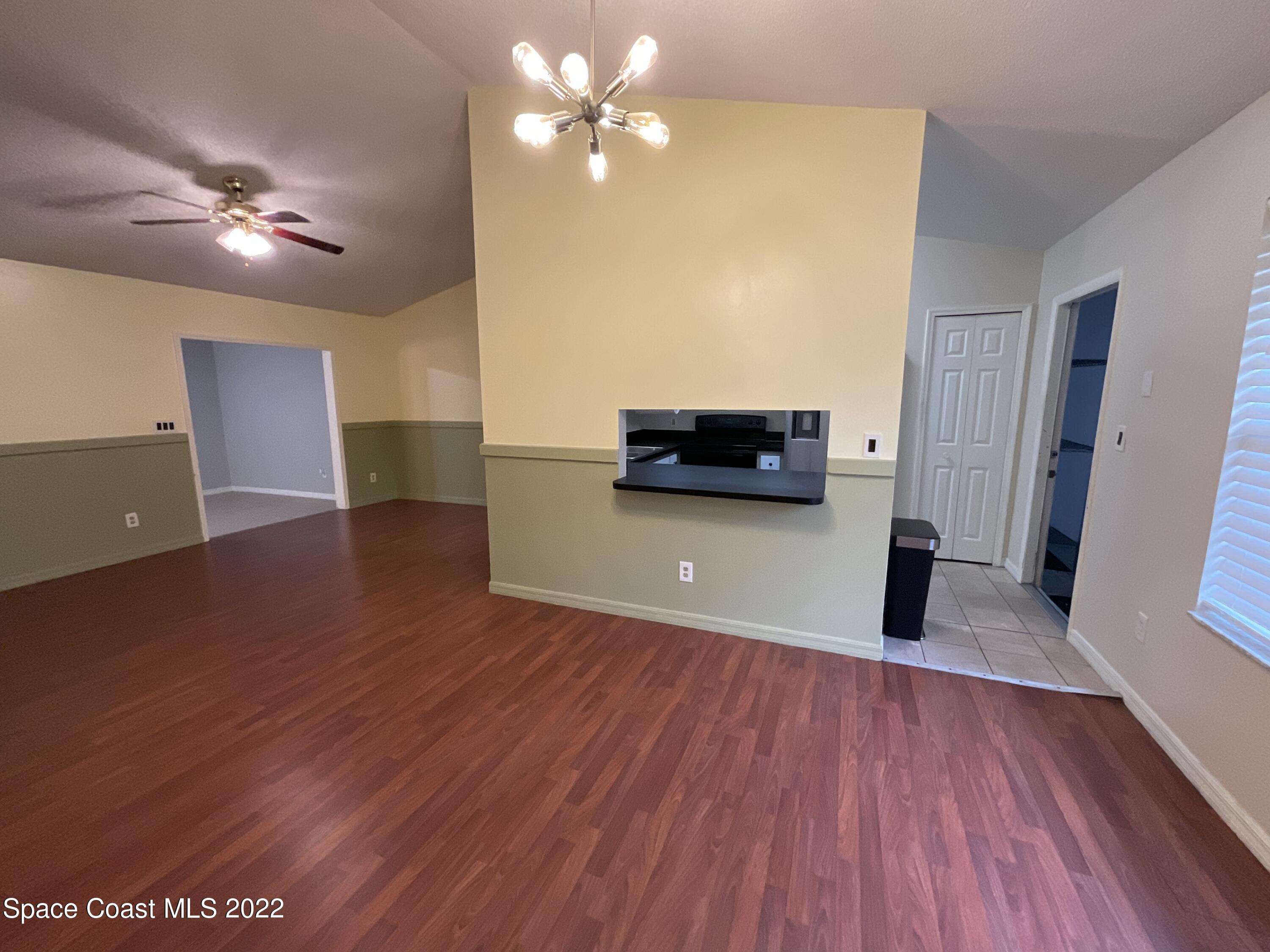 4844 Bridge Road Cocoa, FL 32927 - Photo 20 of 22 a view of a livingroom with furniture wooden floor and ceiling fan