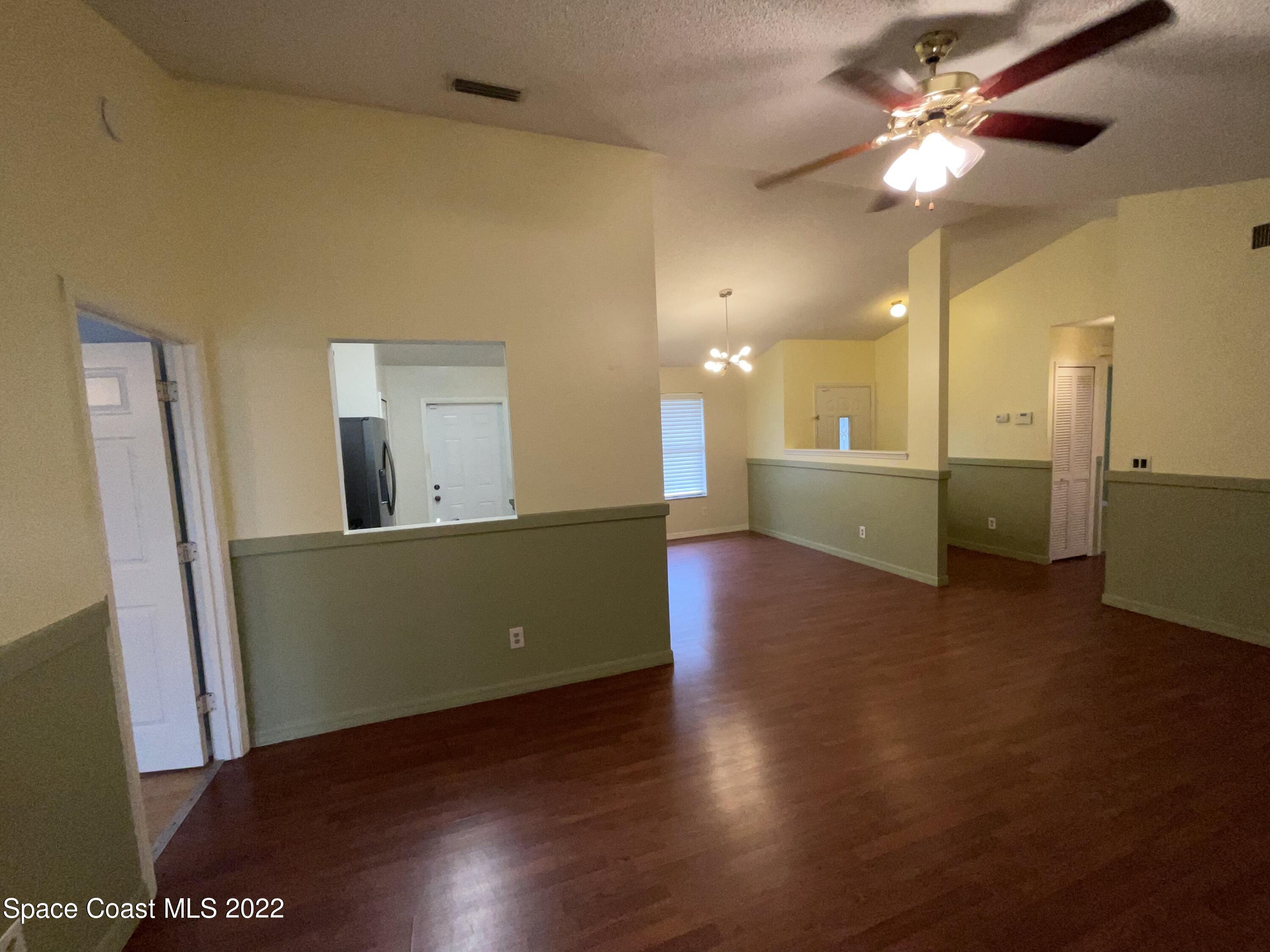 4844 Bridge Road Cocoa, FL 32927 - Photo 22 of 22 a view of a kitchen with a sink cabinets and wooden floor