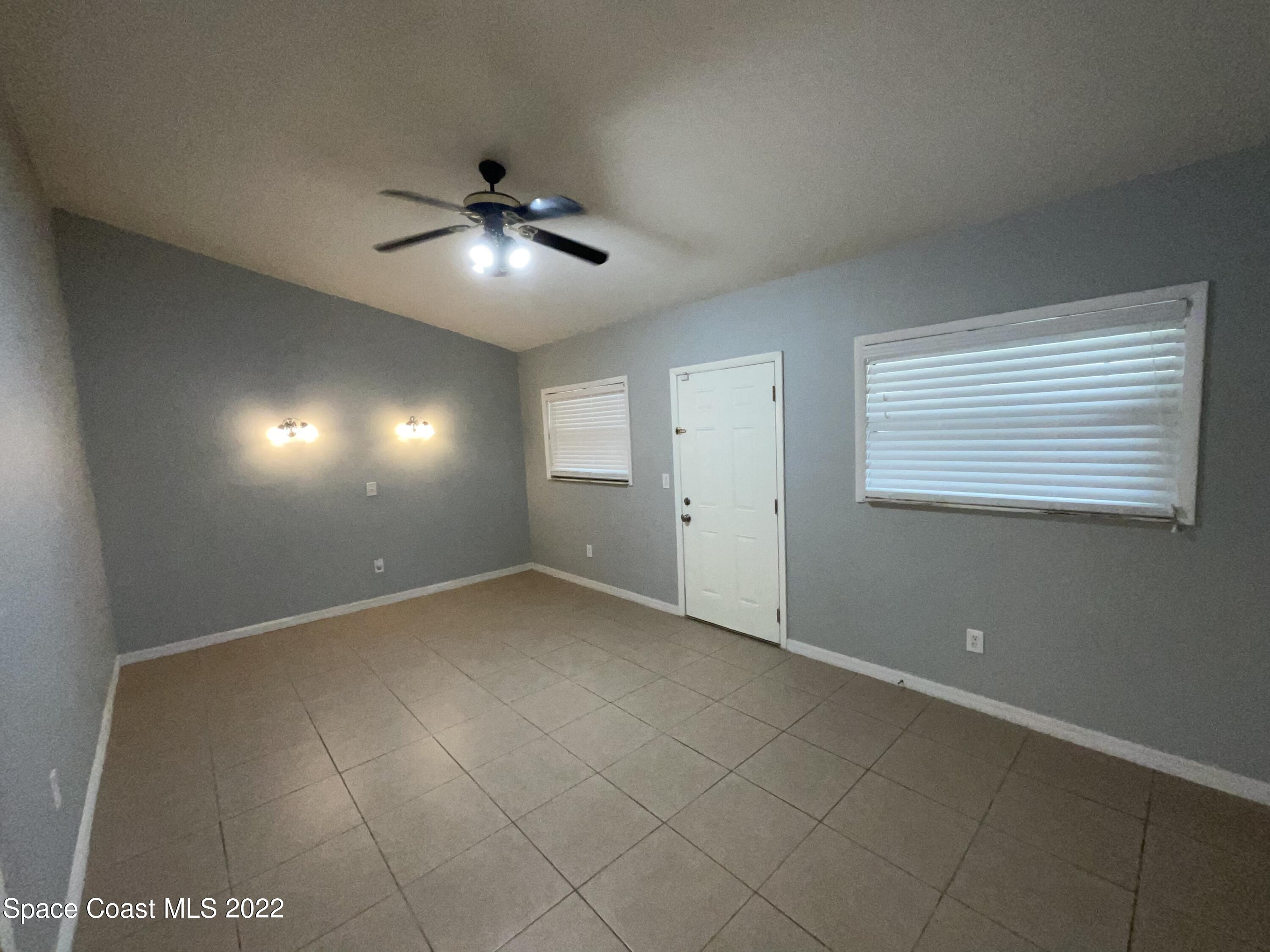 4844 Bridge Road Cocoa, FL 32927 - Photo 4 of 22 a view of an empty room with a window