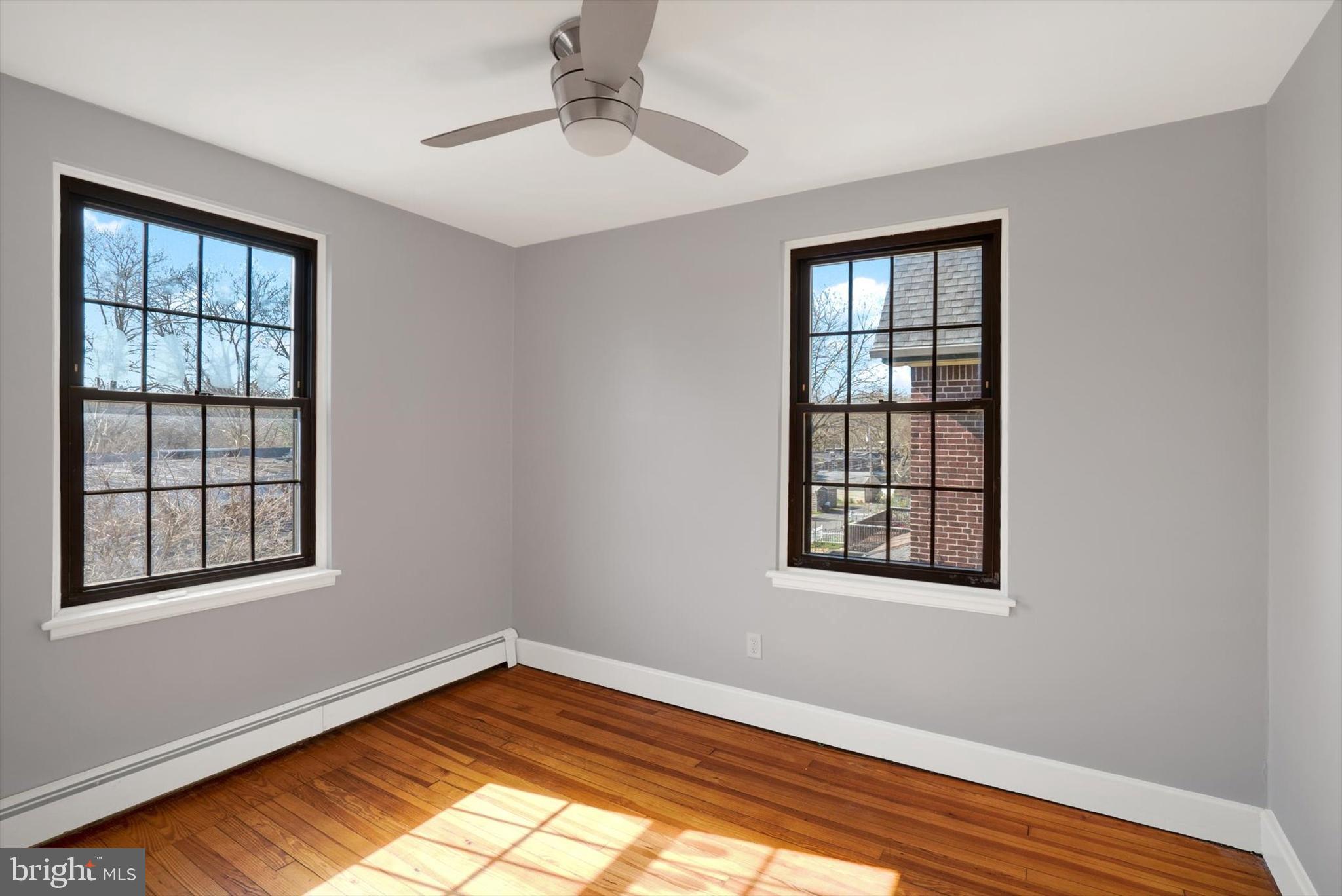 315 Sunset Road Reading, PA 19611 - Photo 12 of 20 a view of an empty room with wooden floor and a window