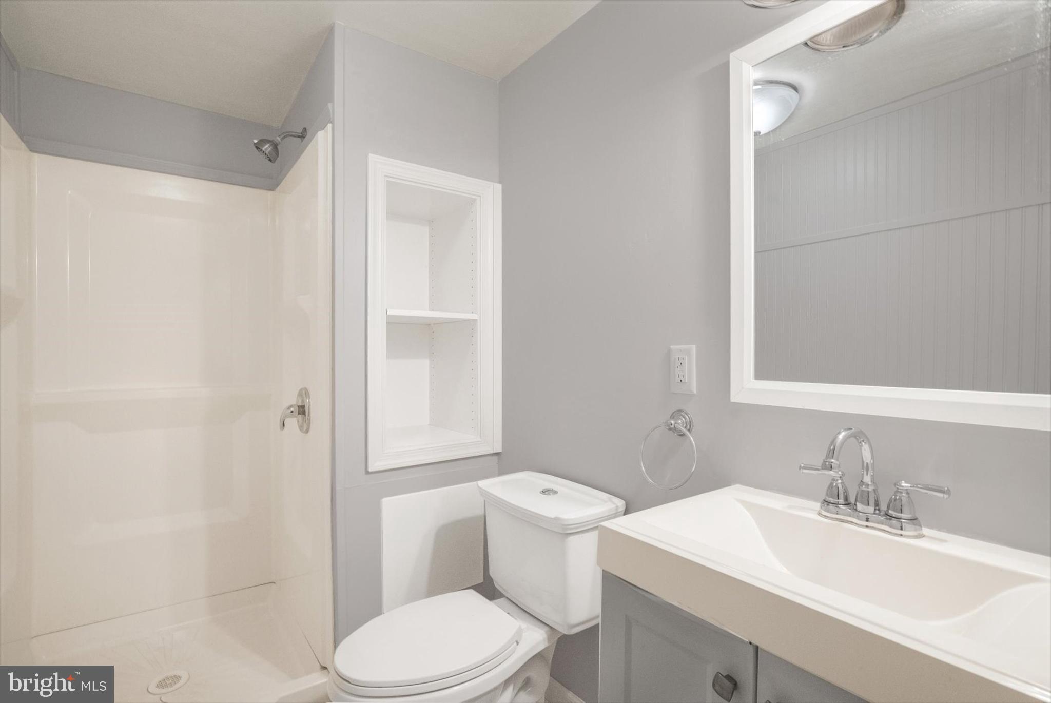 315 Sunset Road Reading, PA 19611 - Photo 15 of 20 a bathroom with a sink toilet vanity and shower