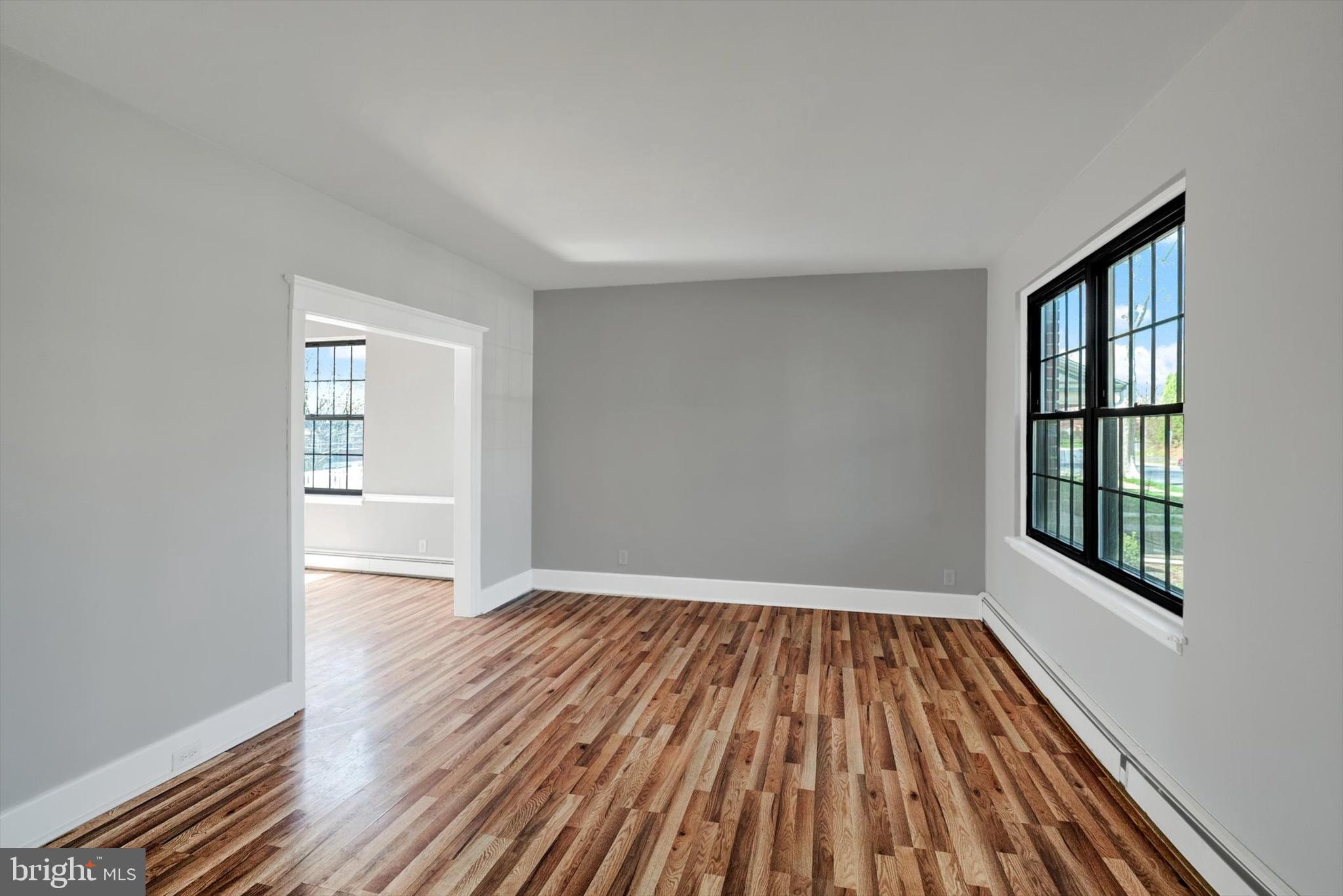 315 Sunset Road Reading, PA 19611 - Photo 3 of 20 wooden floor in an empty room with a window