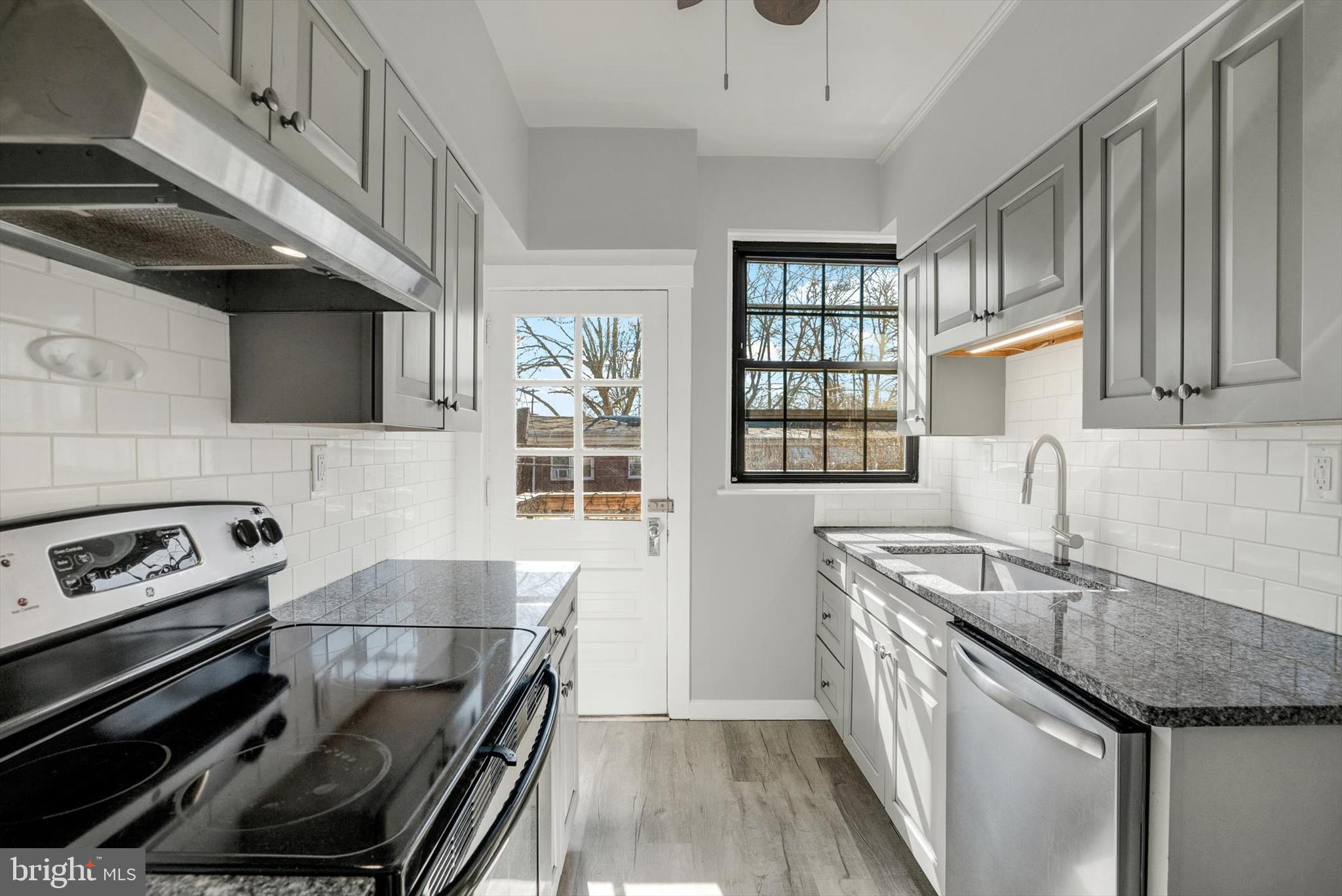 315 Sunset Road Reading, PA 19611 - Photo 7 of 20 a kitchen with granite countertop a stove and a sink