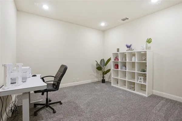 a view of workspace with wooden floor