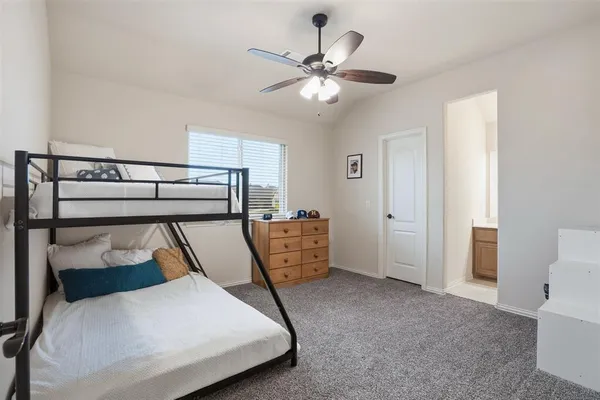 a bedroom with bunk bed and a chandelier
