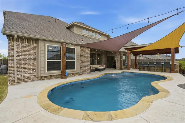 a view of a house with swimming pool