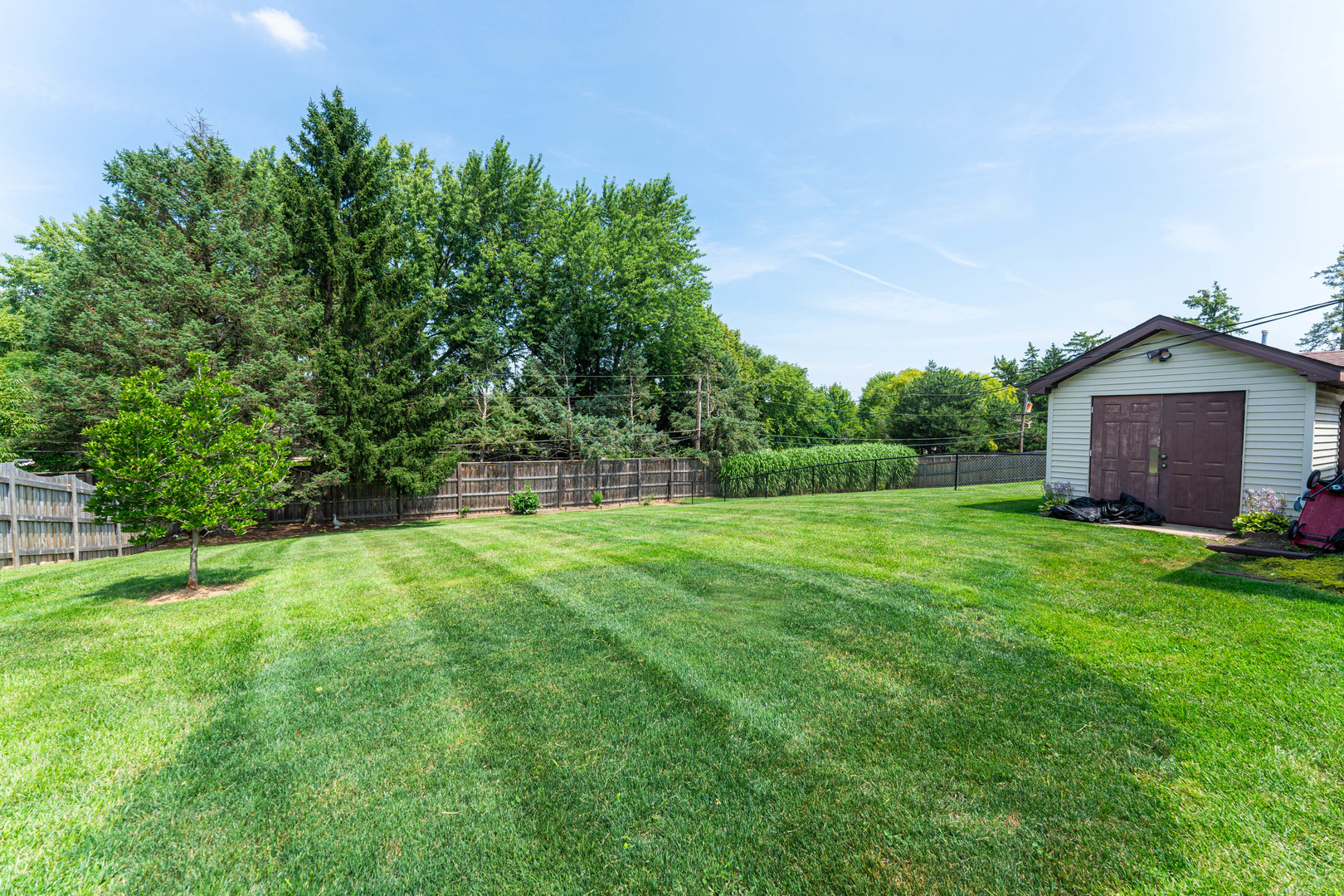 239 Nordic Road Bloomingdale, IL 60108 - Photo 28 of 40 a view of a house with a yard and a garden