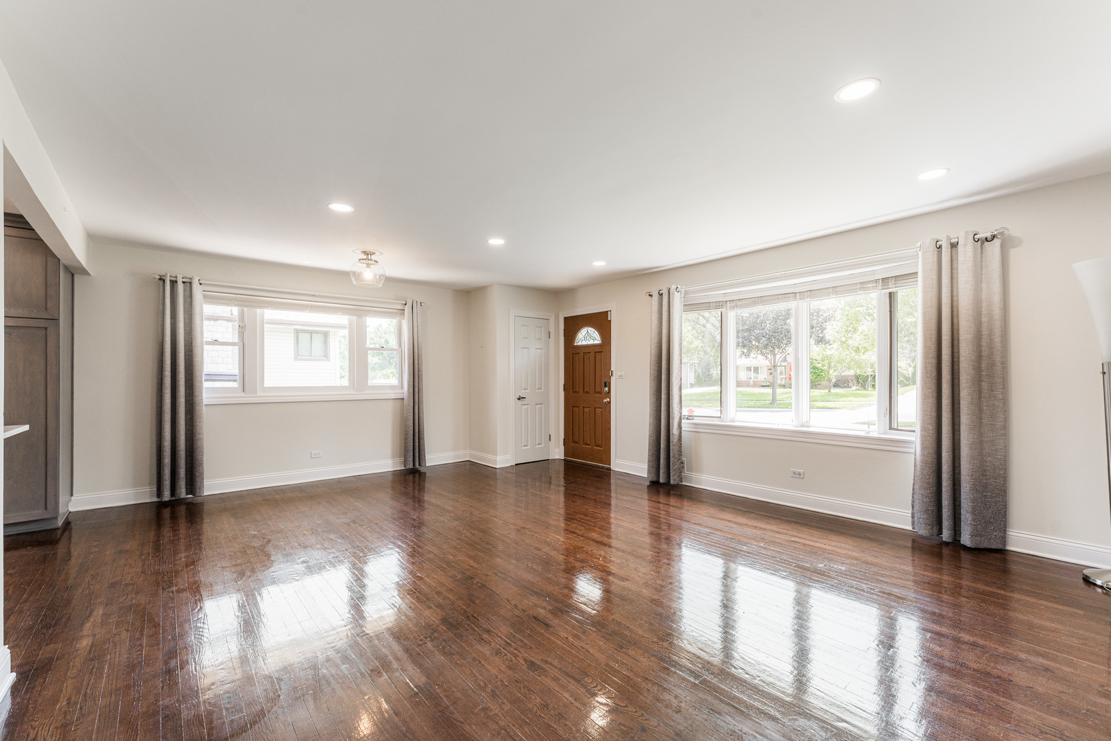 239 Nordic Road Bloomingdale, IL 60108 - Photo 6 of 40 a view of an empty room with wooden floor and a window