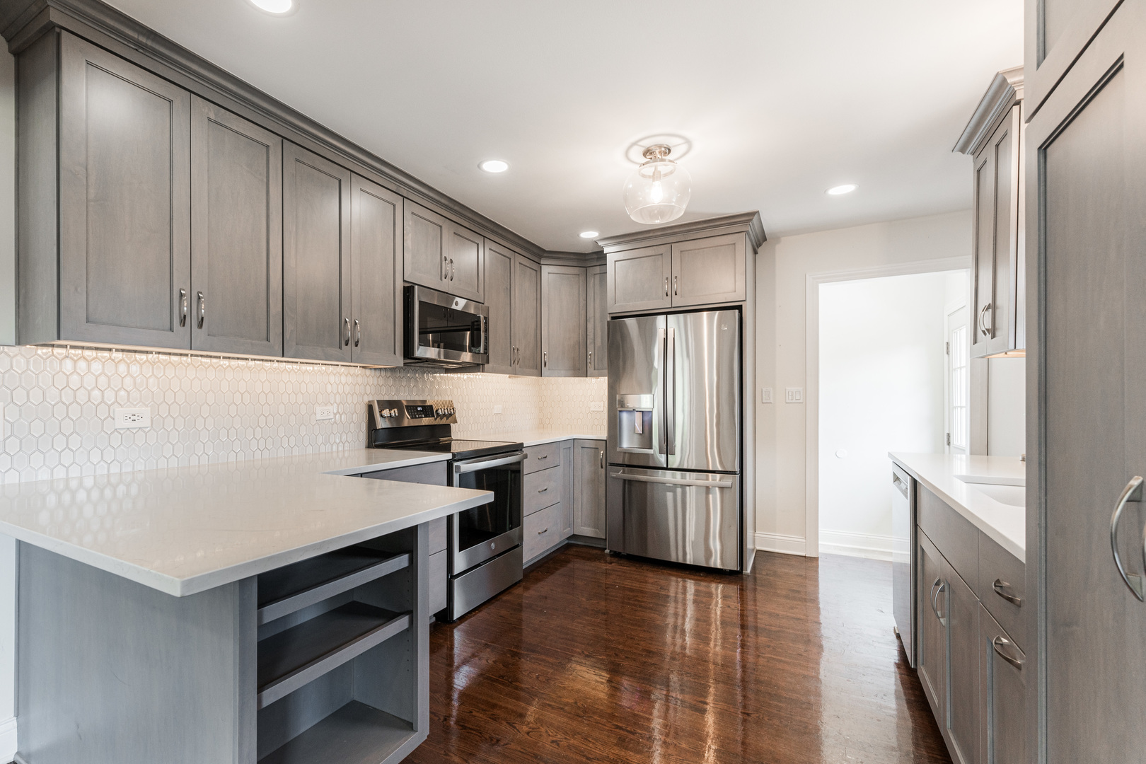 239 Nordic Road Bloomingdale, IL 60108 - Photo 8 of 40 a kitchen with granite countertop a refrigerator stove and kitchen island