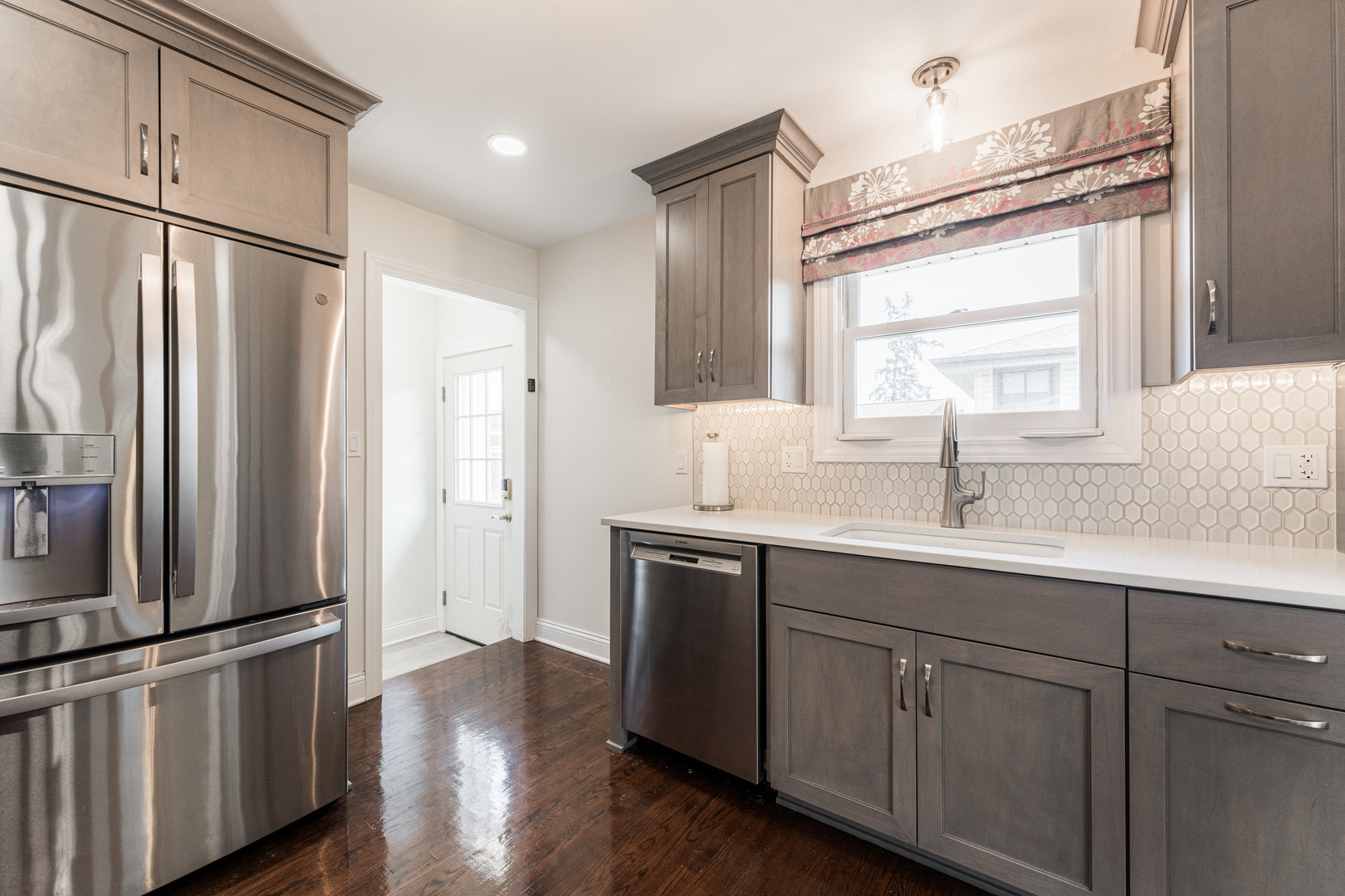 239 Nordic Road Bloomingdale, IL 60108 - Photo 9 of 40 a kitchen with stainless steel appliances a sink and a refrigerator