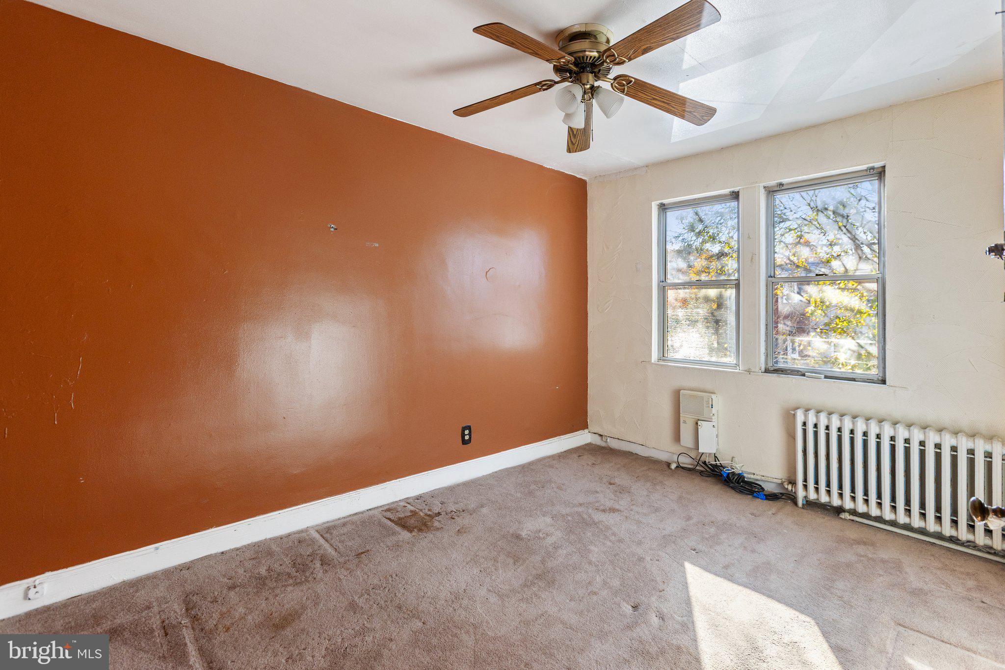 1633 R Street Southeast Washington, DC 20020 - Photo 12 of 44 an empty room with windows and fan view