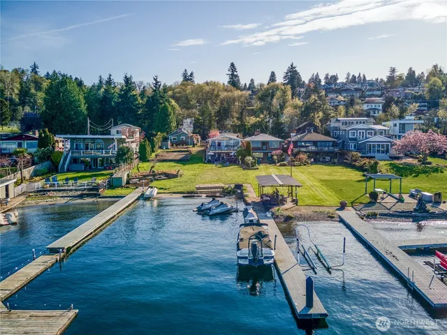 an aerial view of a swimming pool with seating area and hardwood floor