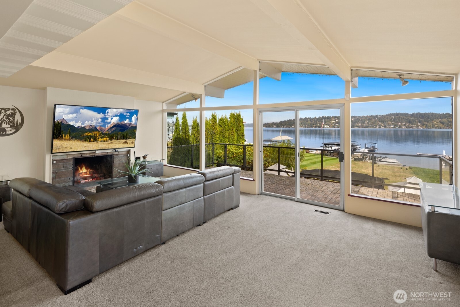 10008 Rainier Avenue South Seattle, WA 98178 - Photo 17 of 40 a living room with furniture a flat screen tv and floor to ceiling window